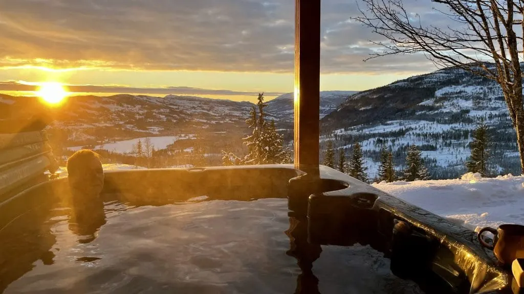 Cozy wooden cabin interior fireplace Norway winter